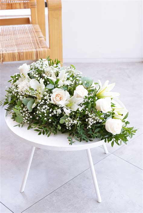 White Roses and White Lily Funeral Spray– Flowers.ie