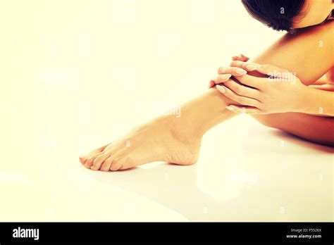 Naked Woman Sitting Curled Up Stock Photo Alamy