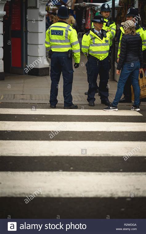 London Uk February 2019 Policemen Patrolling The Crowded Streets