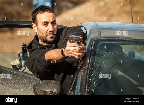 Police agent and bodyguard training action gun shooting from car ...