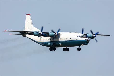 Cavok Air Antonov An Cargo Plane At Airport Apron With Marshaller