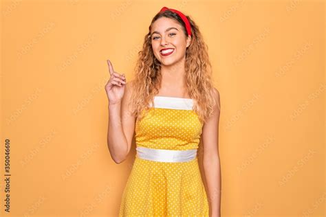 Beautiful Blonde Pin Up Woman With Blue Eyes Wearing Diadem Standing