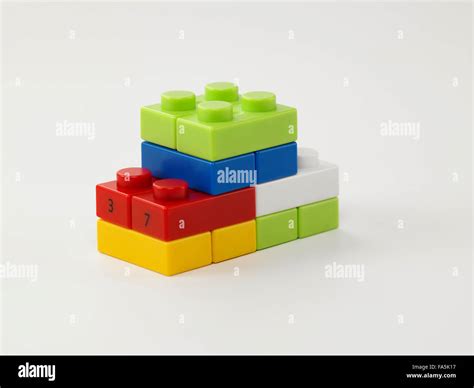 Lego Pieces Stack Up On The White Background Stock Photo Alamy