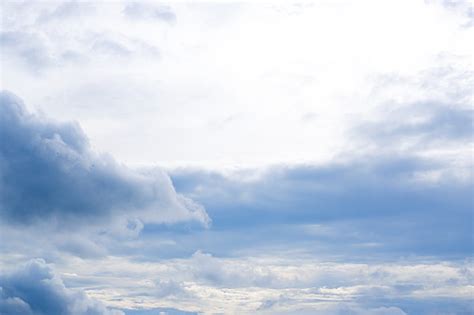 Clear Blue Sky With Wisps Of White Clouds On The Horizon Stock Photo