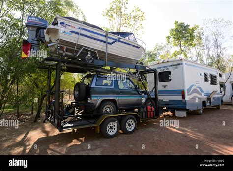 Motorhome Towing A Boat And Secondary Car Northern Territory