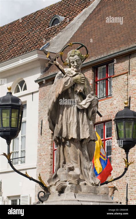 The Statue Of Saint John Nepomuk In The Centre Of Bruges Belgium Stock