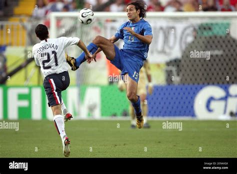 USA's Landon Donovan and Italy's Alessandro Nesta battle for the ball ...