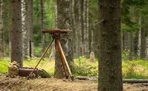 Wooden Tripod And A Table For Cards Of Wartime Cartographer Equipment