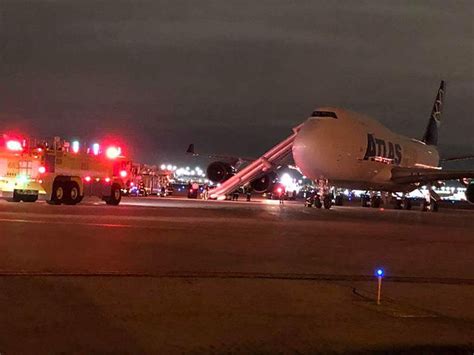 Pilots on Atlas Air Boeing 747-400F were evacuated via emergency slide