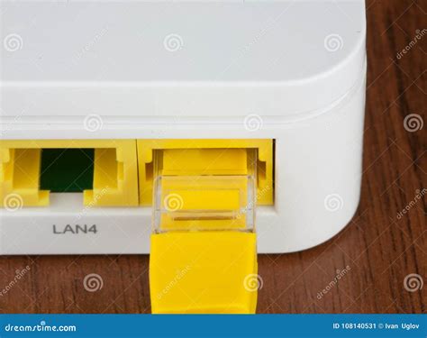 Closeup Back Of White Wifi Router Lan Port With Utp Patch Cord Inside