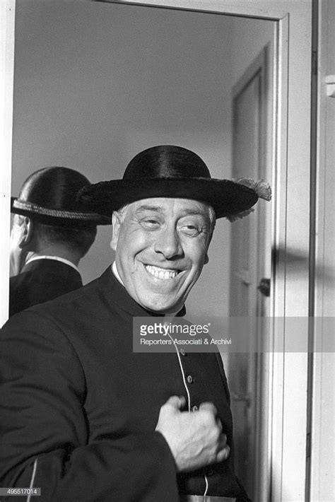 The Actor Fernandel Smiling In Cassock During A Break On The Set Of The