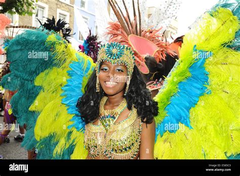 Women Wearing Traditional Caribbean Carnival Costume At Notting Hill