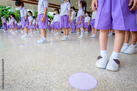 Picture of school children standing in line in kindergarten and ...