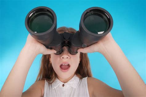 Beautiful Young Girl Looking Through Binoculars With Surprised