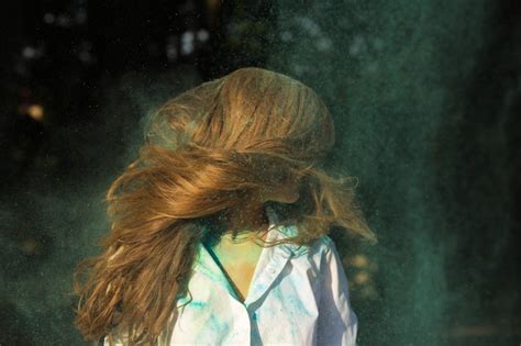 Premium Photo Closeup Portrait Of Stylish Blonde Woman With Lush Hair Posing With Paint Holi