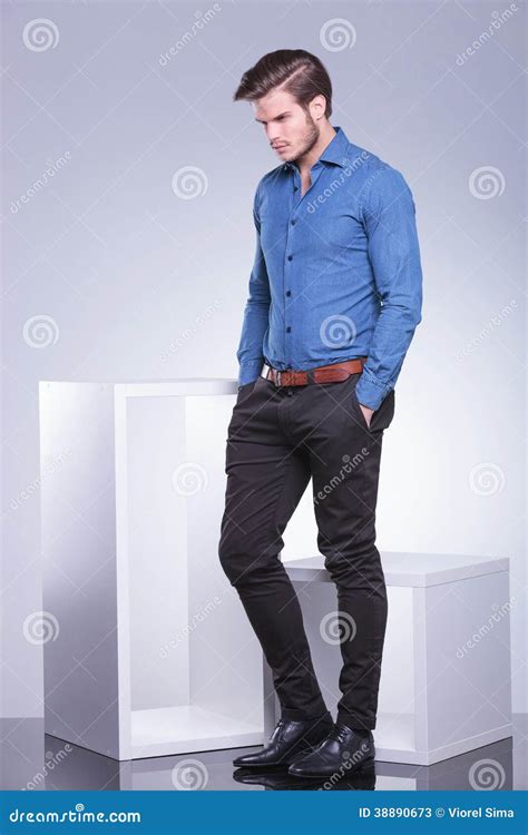 Sad Casual Man Standing With Hands In Pockets Stock Photo - Image: 38890673