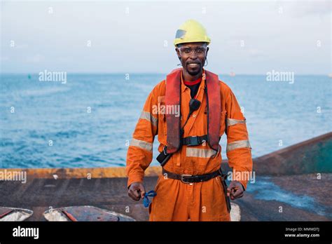 Seaman Ab Or Bosun On Deck Of Offshore Vessel Or Ship Wearing Ppe Personal Protective