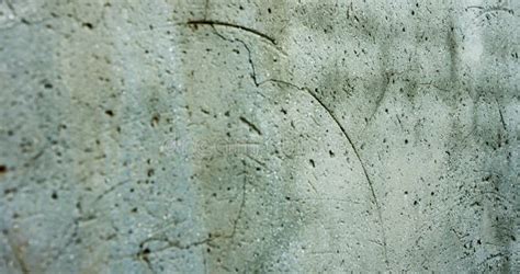 Abstract Ageing Grey Concrete Wall Wih Textures Of Cracks And Stains