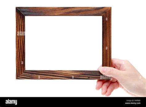 Hand holding wooden picture frame on white background Stock Photo - Alamy