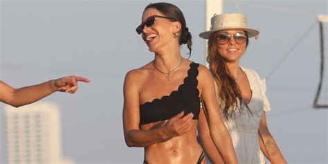 Camila Coelho Stuns In A Black Bikini At The Beach With Friends