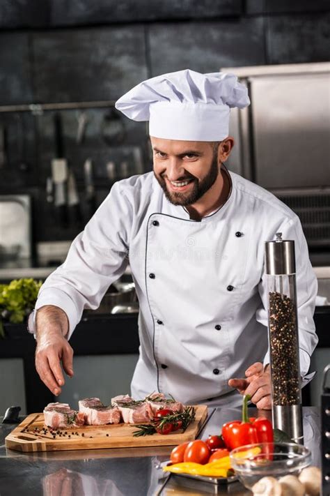 Chef Male Prepare Steak at Kitchen. Happy Chef Cook Meat at Kitchen ...