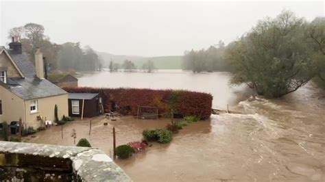 Cars float off and people stranded in homes by flooding in Scotland as ...