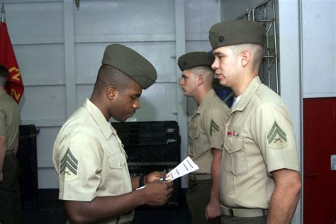 US Marine Corps (USMC) Sergeant (SGT) Wayne Hairston, a Corporal's Course instructor, with the ...