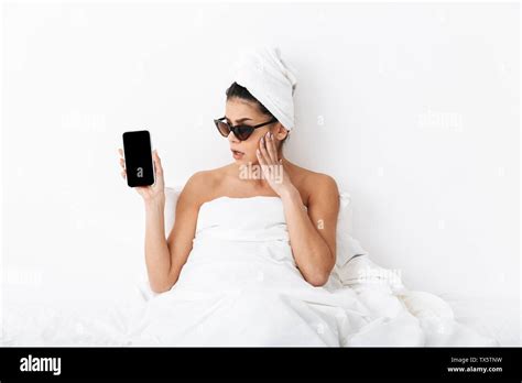 Image Of A Beautiful Surprised Emotional Woman With Towel On Head Lies