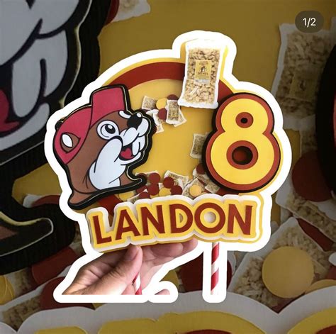 A Hand Holding Up A Sticker With The Number Eight On It And An Image Of