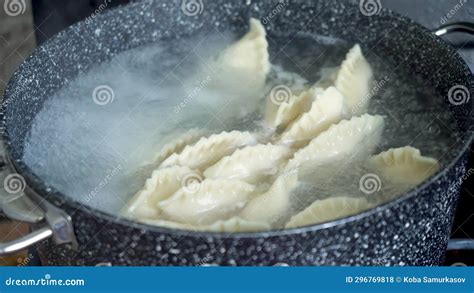 Handmade Dumplings Vareniki Are Boiled In Boiling Water In A Saucepan