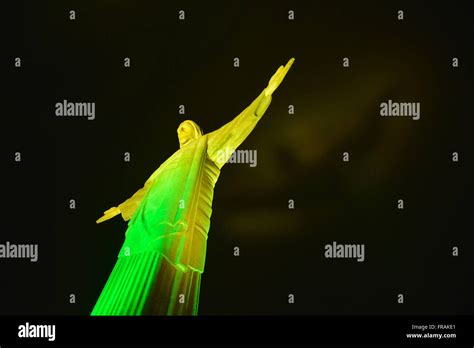 Night view of Christ the Redeemer ilumidado with the colors of the ...