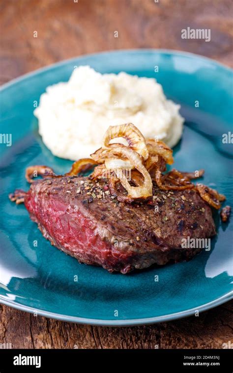 grilled steak with roasted onions Stock Photo - Alamy