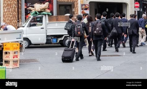 A Group Of Japanese Salaryman Or Office Worker In Shibuya Street Tokyo