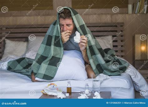 Sick Wasted And Exhausted Man At Home Bed Lying Feeling Unwell