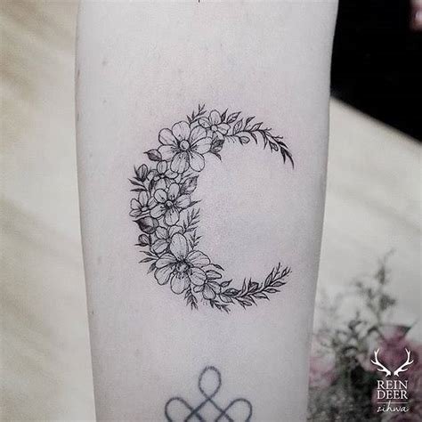 Moon Shaped Flower Wreath Tattoo On The Forearm