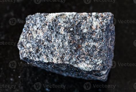 unpolished Nepheline Syenite rock on black 14937675 Stock Photo at Vecteezy