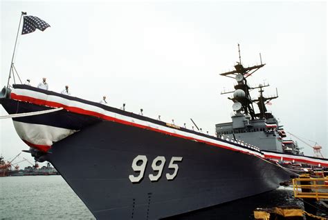 Crew Members Man The Port Rails During The Commissioning Of The Guided