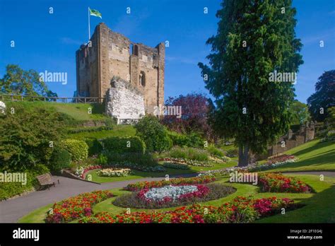 Guildford Castle And Grounds In Summertime With Beds Of Colourful Flowers