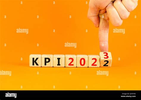 Kpi Key Performance Indicator Symbol Businessman Turns Wooden Cubes