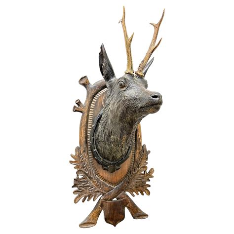 Grande tête de cerf en bois sculpté d art populaire avec de vrais bois