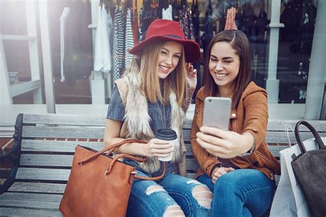 Shopping And Selfies Two Young Girlfriends Snapping Selfies While