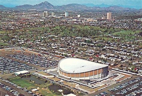 An Aerial View Of A Parking Lot And Stadium