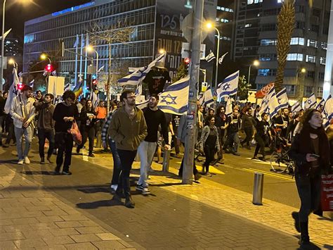 Tel Aviv demonstrators march along Kaplan Street in the direction of