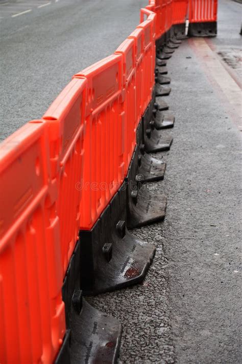 Photo of a Line of Plastic Orange Safety Barriers Stock Photo - Image ...