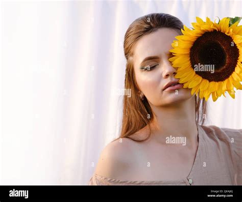 Romantic Woman With Sunflowers Over White Fabric Background Clean Skin