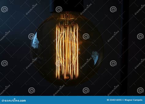 Close Up Of A Glowing Incandescent Light Bulb Filaments Stock Image