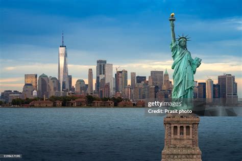 The Statue Of Liberty With Downtown New York Skyline Panorama With