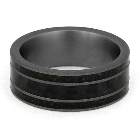 This Carbon Fiber Ring Is Accented By Two Crushed Dinosaur Bone Inlays