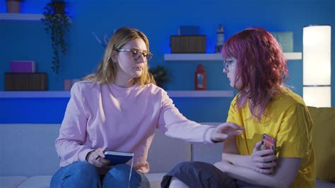 Friends hiding secrets from each other on the phone. 32425925 Stock