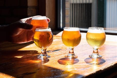 Premium Photo Close Up Of Beer Glasses On Table